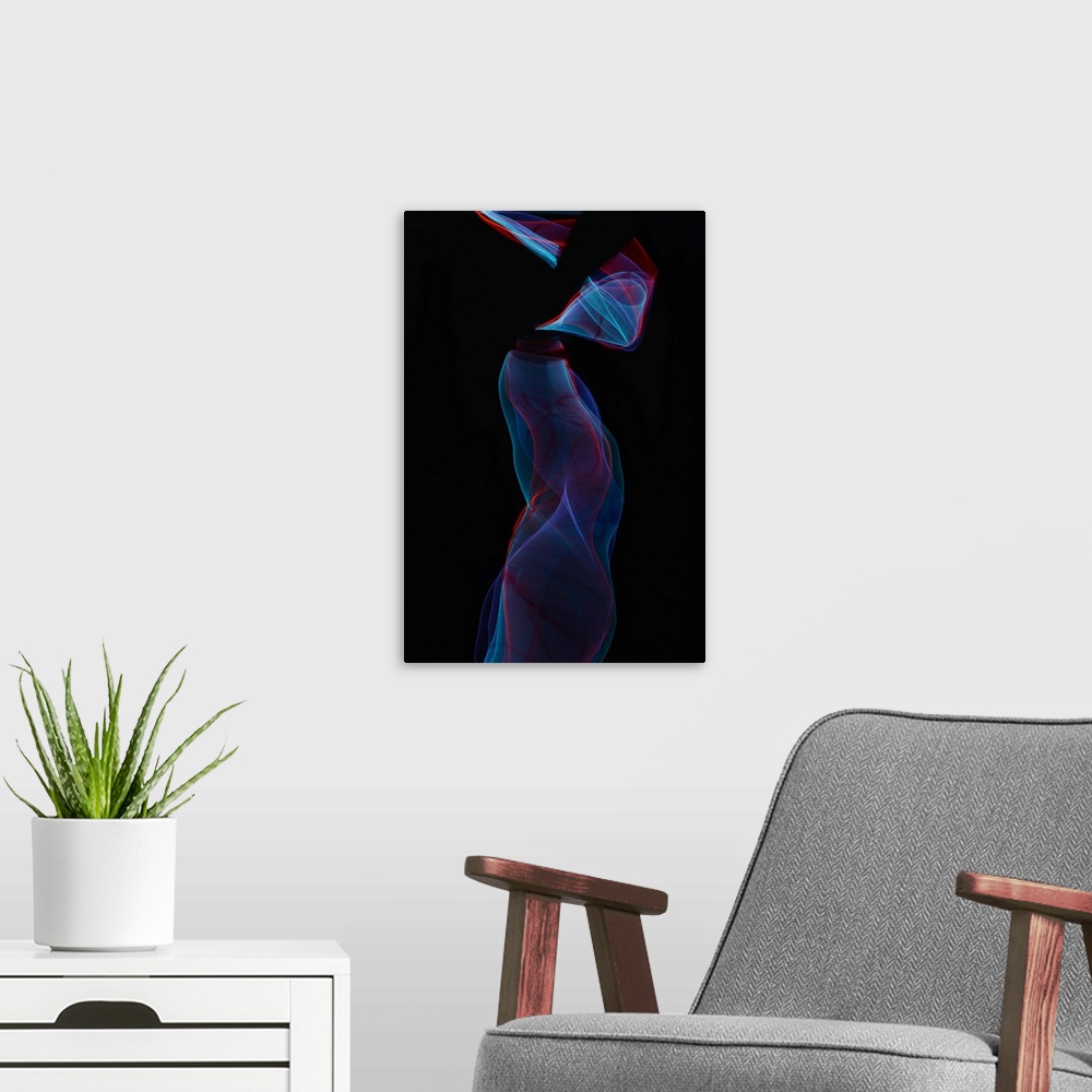 A modern room featuring Abstract image created by trailing blue and red lights, resembling wisps of smoke.