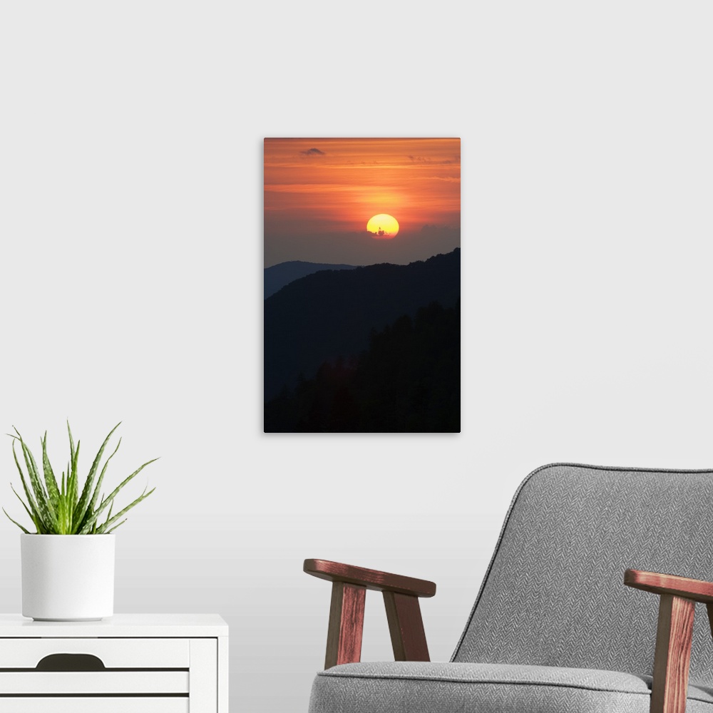 A modern room featuring Sun setting behind clouds, silhouetted mountains, Great Smoky Mountains National Park, Tennessee