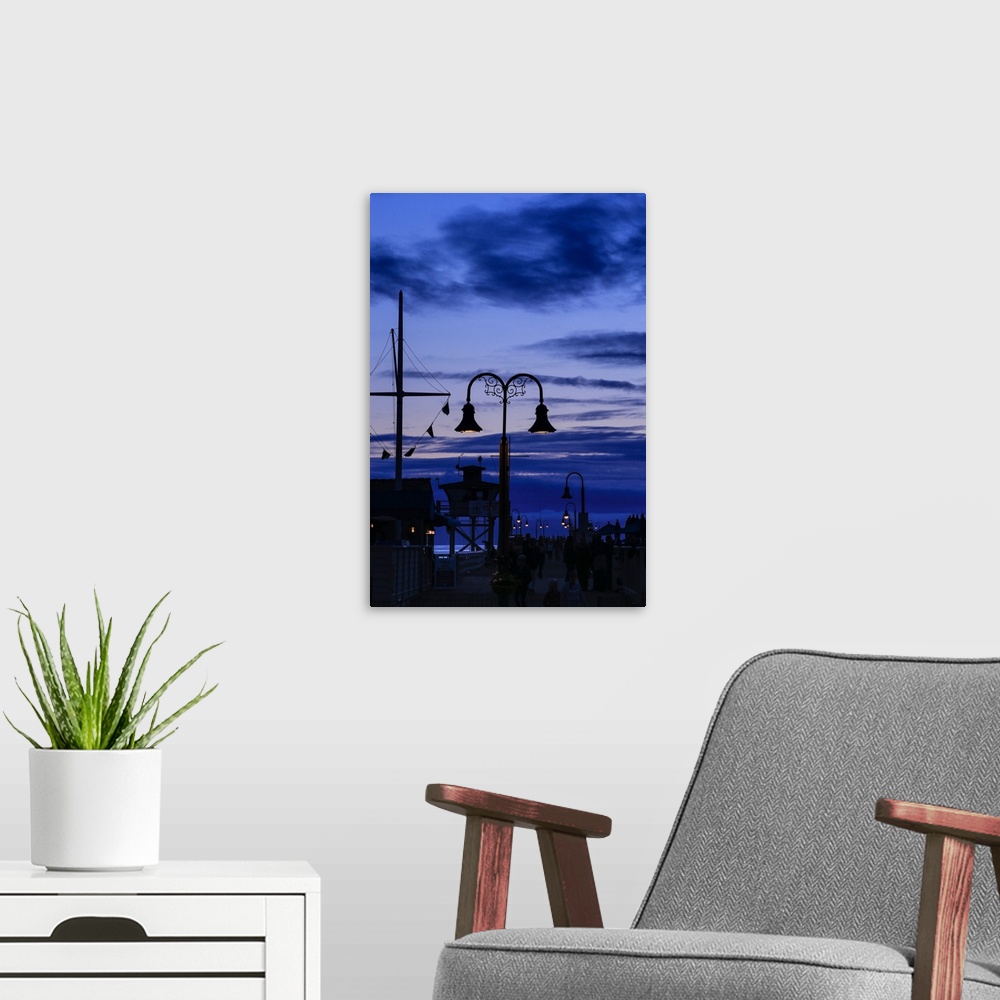 A modern room featuring Tourists on the pier on the beach at dusk, San Pedro, Los Angeles, California, USA