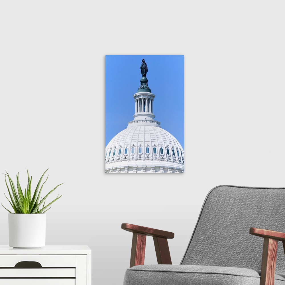 A modern room featuring U.S. Capitol Dome and Statue of Freedom with Indian Headdress overlooks Washington D.C.