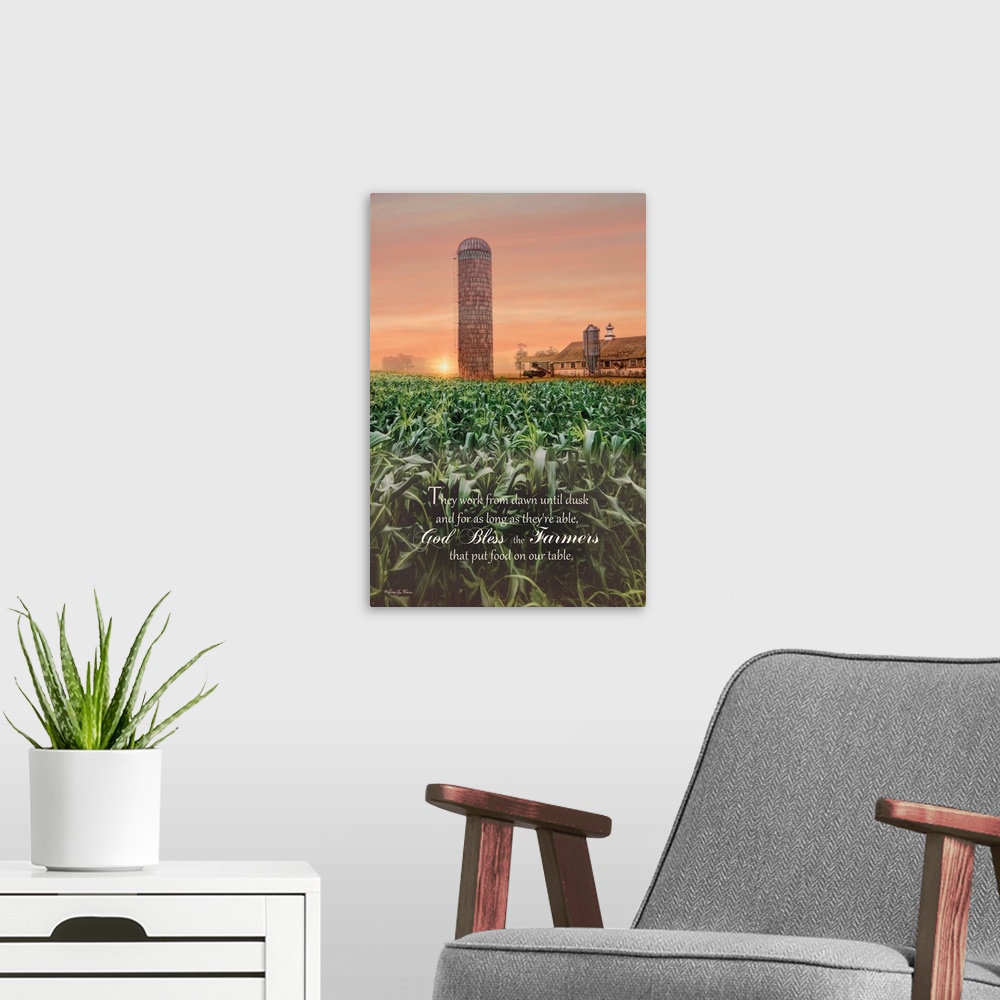 A modern room featuring A prayer for farmers over an image of green fields near a silo and farmhouse at sunset.