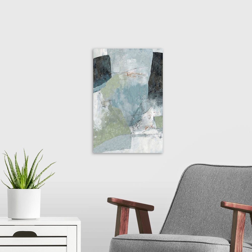 A modern room featuring Vertical abstract painting in muted colors of blue, green and gray.