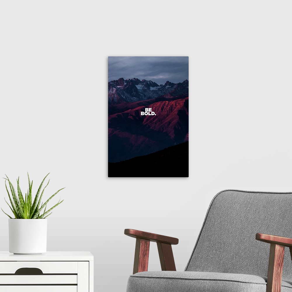 A modern room featuring Motivational sentiment over a dramatic sunset mountain view.