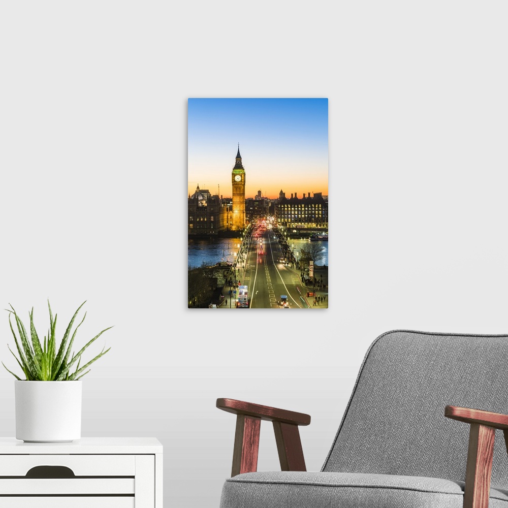 A modern room featuring Big Ben, and busy traffic on Westminster Bridge at dusk, London, England