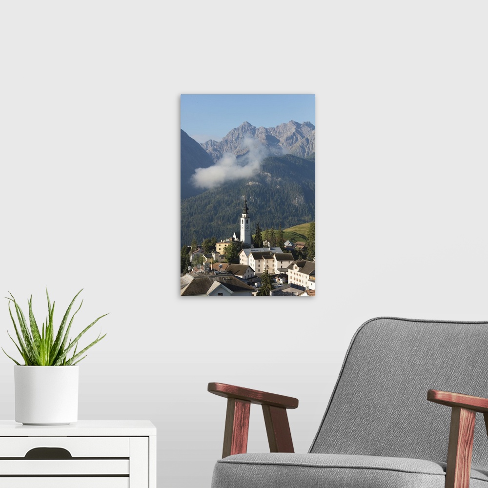 A modern room featuring Blue sky on the alpine village of Ftan surrounded by rocky peaks, Inn district, Canton of Graubun...