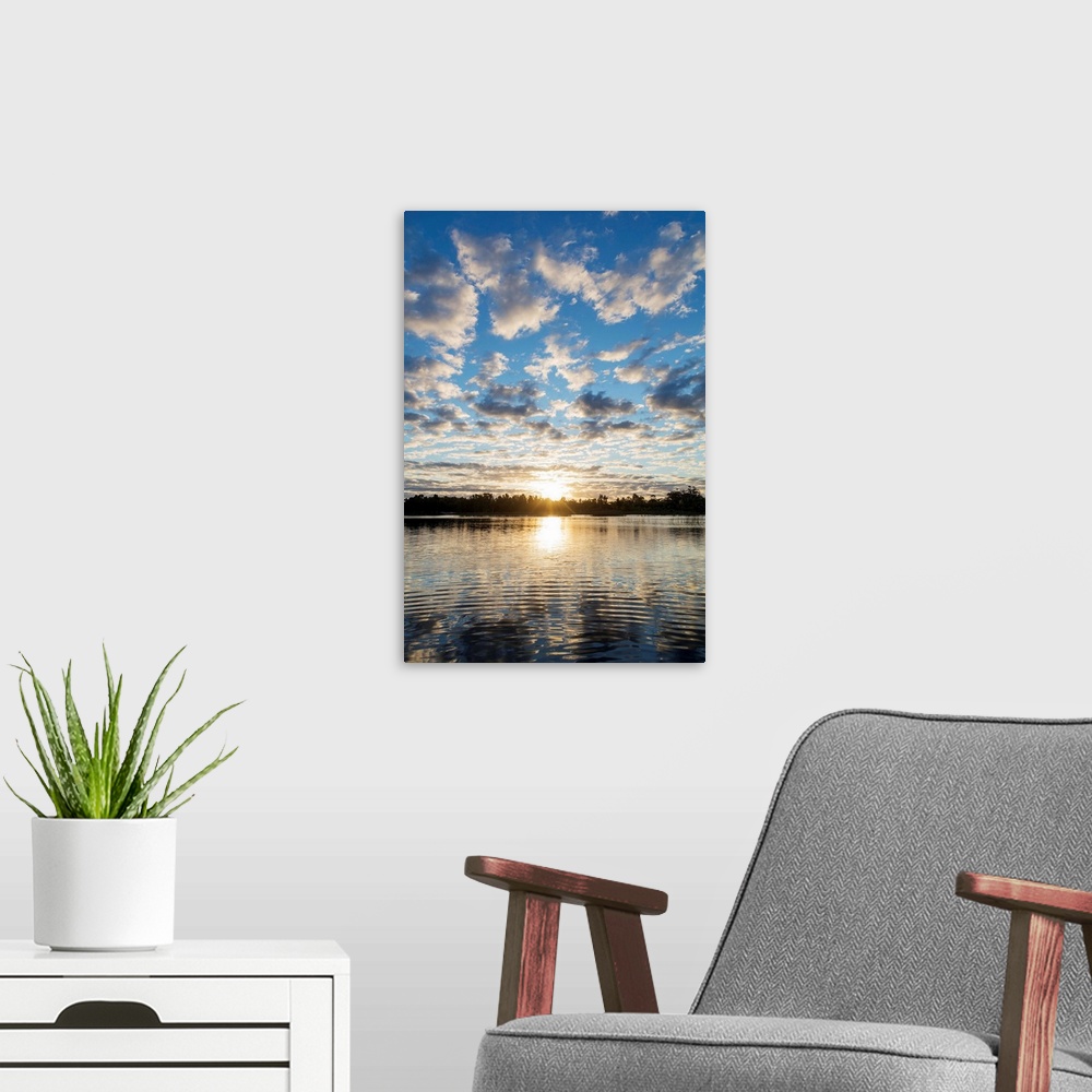 A modern room featuring Clouds at sunset, Pangalanes Lakes canal system, Tamatave, Madagascar, Africa