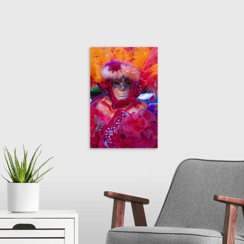 A modern room featuring Colourful mask and costume of the Carnival of Venice, famous festival worldwide, Venice, Veneto, ...