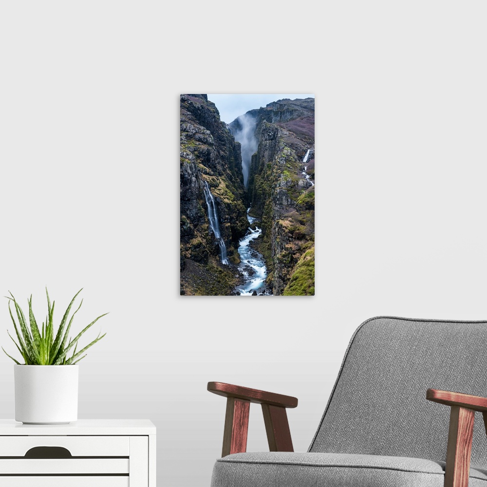 A modern room featuring Glymur Waterfall, Iceland