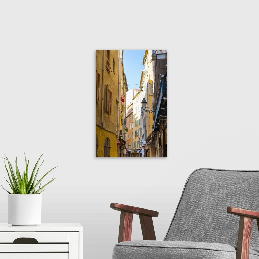 A modern room featuring Narrow street in the Old Town, Vieille Ville, Nice, Alpes-Maritimes, Cote d'Azur, Provence, Frenc...