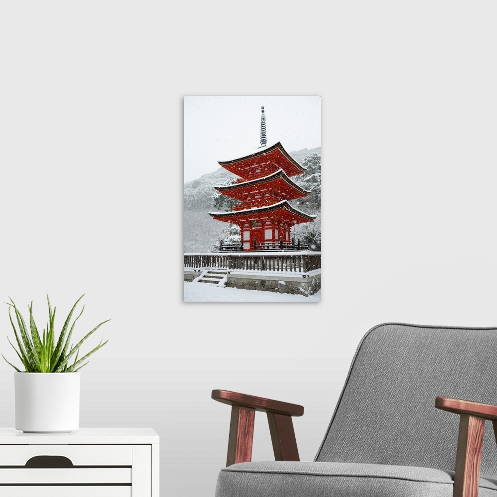 A modern room featuring Snow falling on small red pagoda, Kiyomizu-dera Temple, Kyoto, Japan