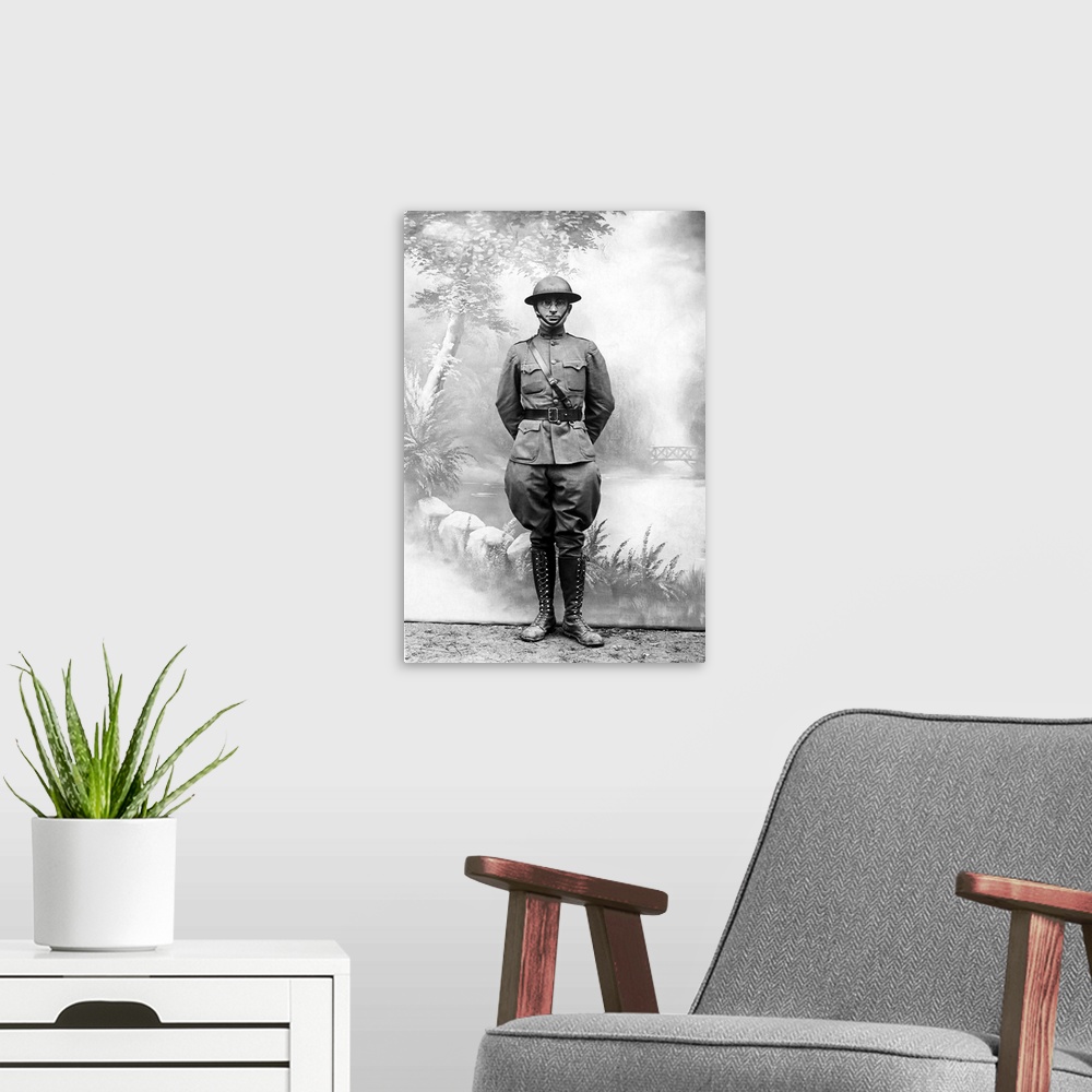 A modern room featuring Harry S. Truman standing in front of a standard postcard backdrop during the first World War.