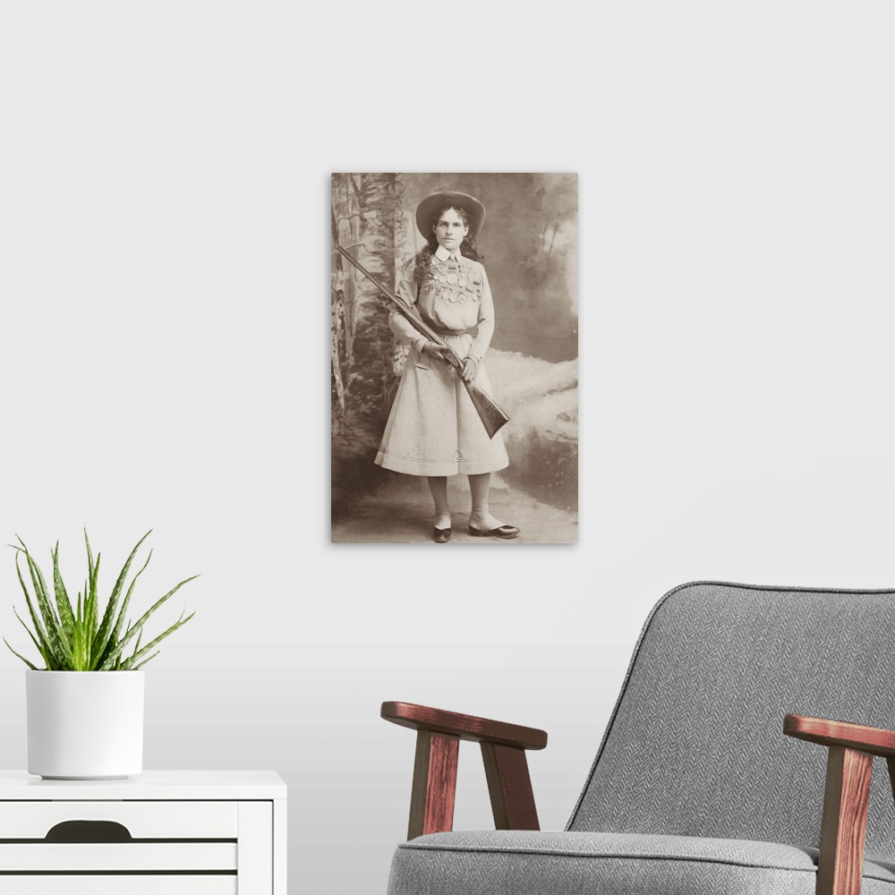 A modern room featuring Portrait of sharpshooter Annie Oakley holding a rifle.