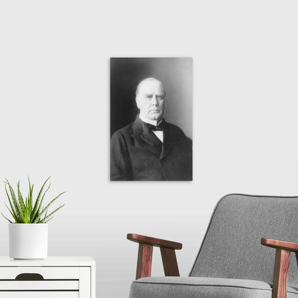 A modern room featuring William McKinley, half-length portrait, facing slightly right, circa 1900