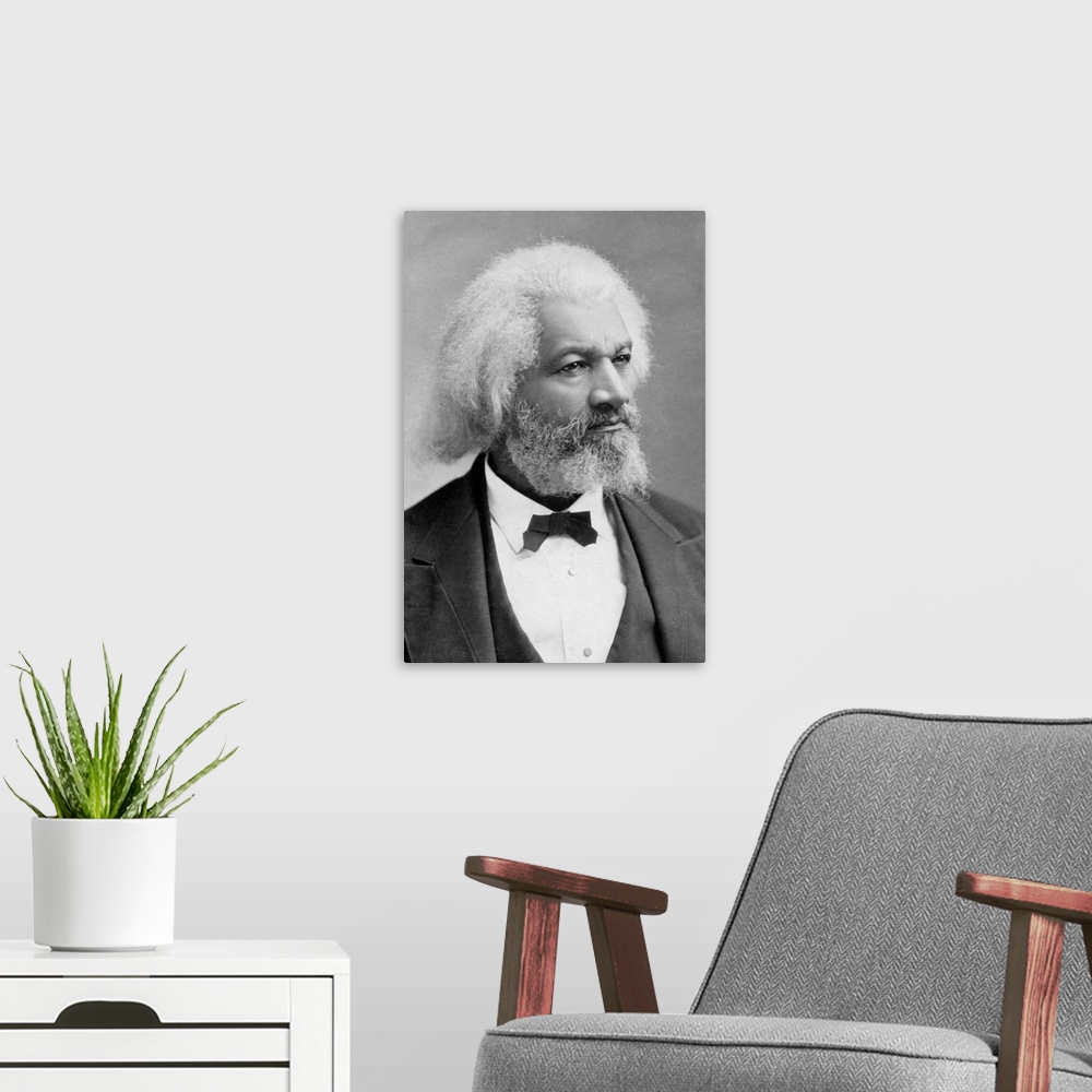 A modern room featuring FREDERICK DOUGLASS (c1817-1895). American abolitionist and writer. Photograph, c1880.