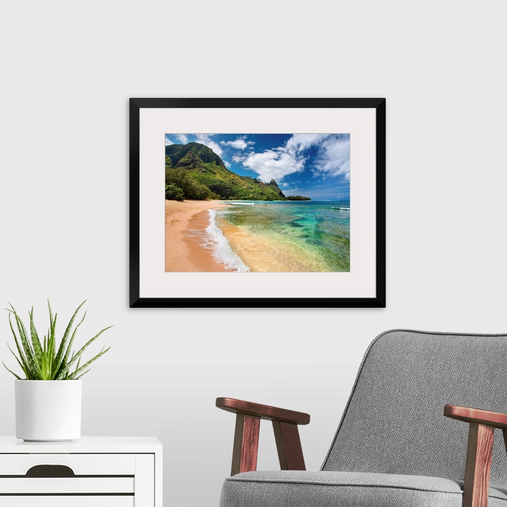 A modern room featuring Big photograph shows the clear waters of the Pacific Ocean slowly making their way to the sandy s...