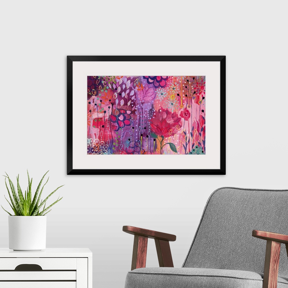 A modern room featuring Contemporary painting of a vibrant wildly colored flowers.