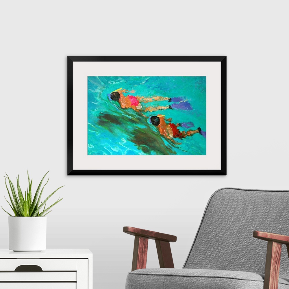 A modern room featuring Huge contemporary art shows a man and woman snorkeling through clear water.  As the two people tr...