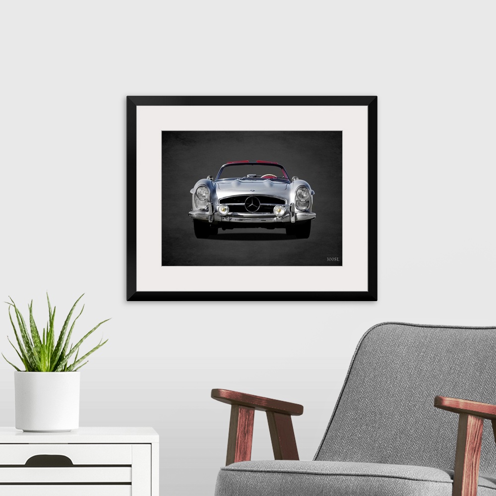 A modern room featuring Photograph of a silver 1958 Mercedes Benz 300SL printed on a black background with a dark vignette.