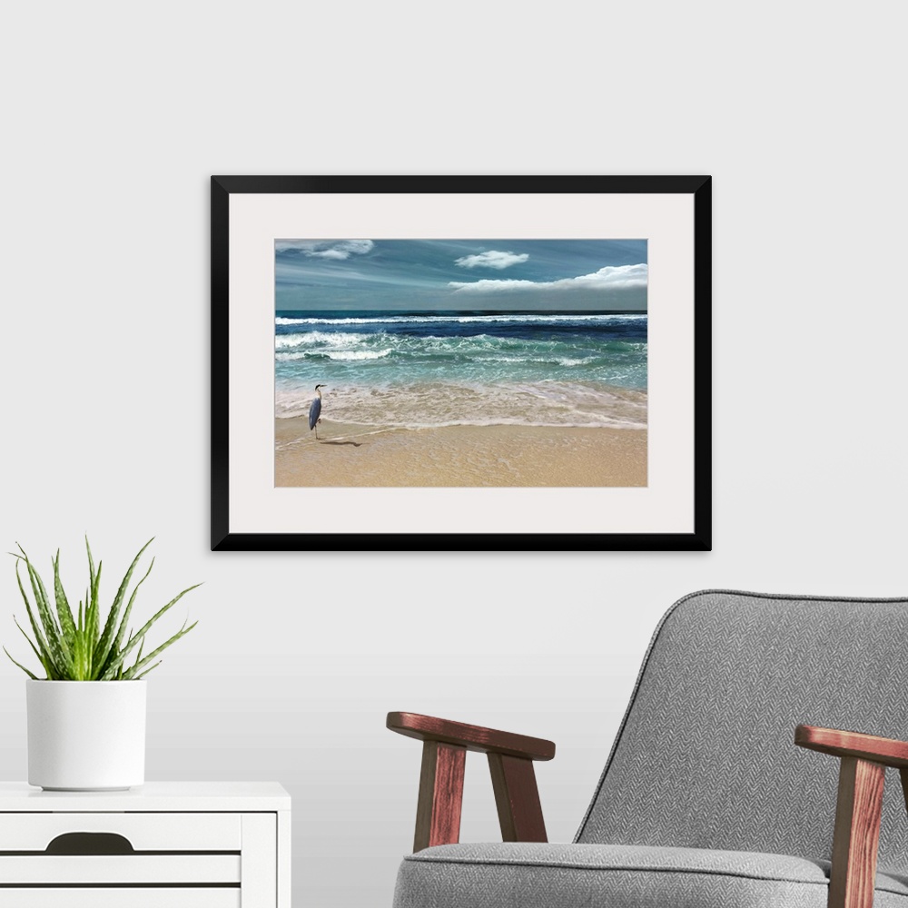 A modern room featuring This serene photo shows rippling waves as they approach the heron on the beach with white clouds ...