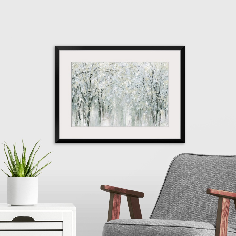 A modern room featuring Abstract painting of a winter scene with snow covered trees.