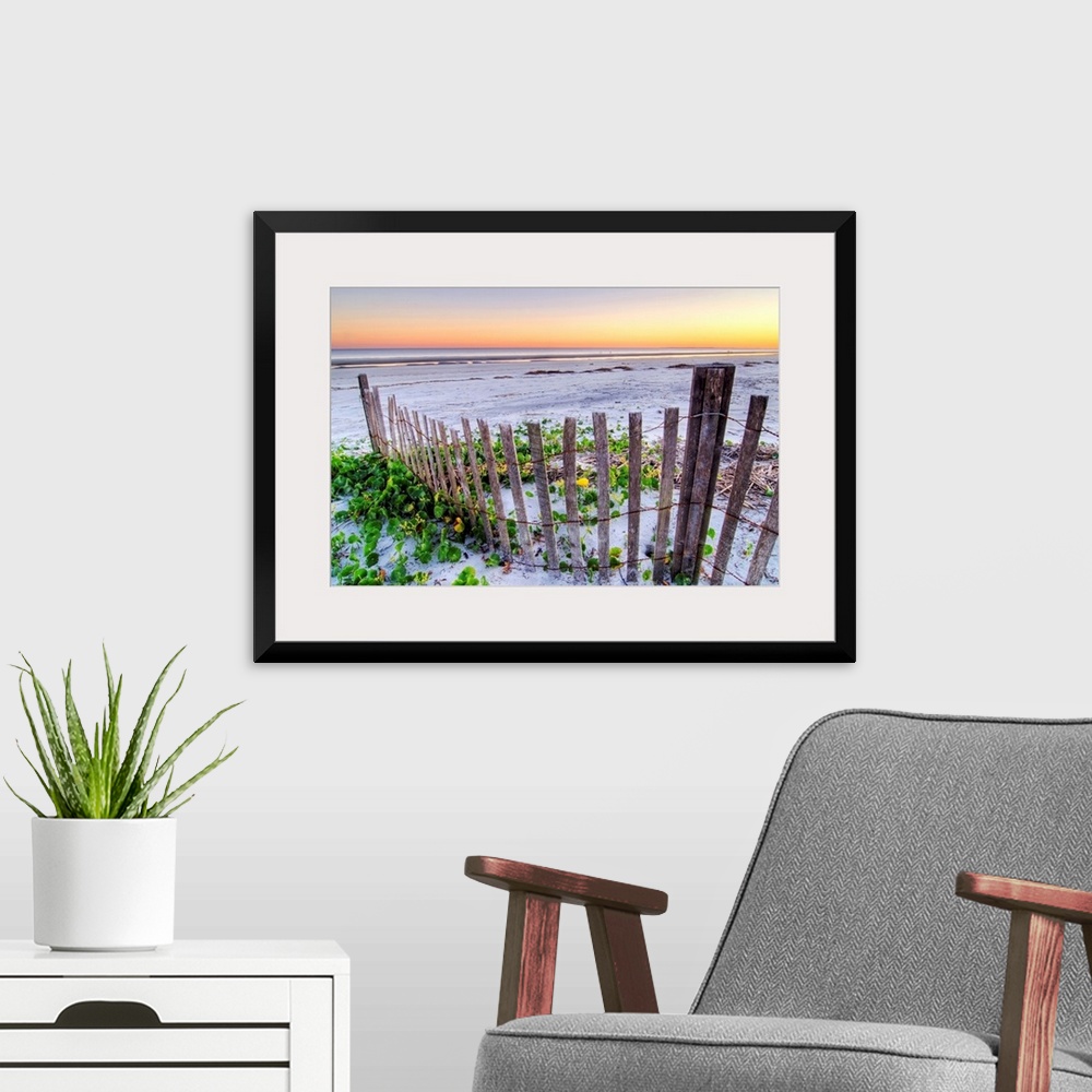 A modern room featuring Wall art for the home or office this landscape photograph is of a battered barrier fence ends on ...