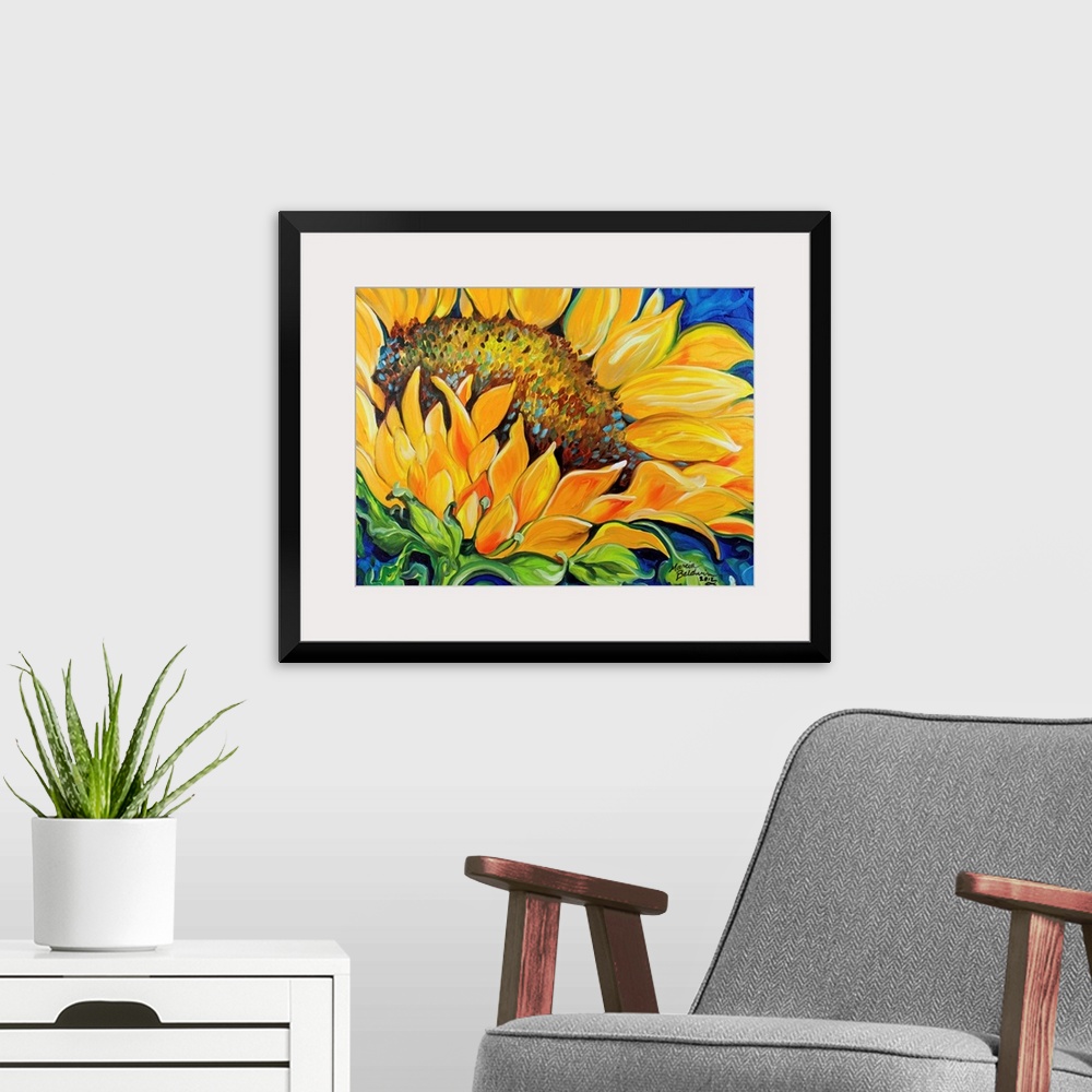 A modern room featuring Contemporary painting of a sunflower up close on a blue background.