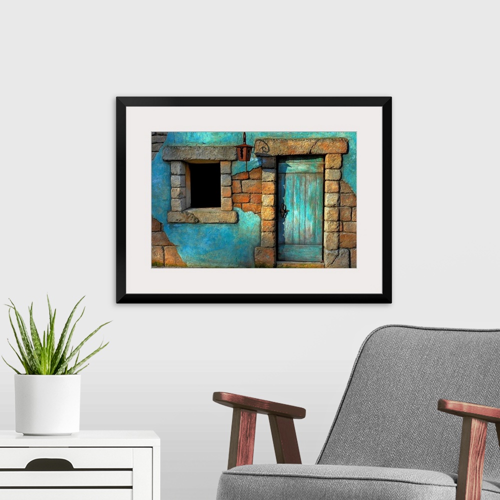 A modern room featuring Landscape fine art photograph highlighting a door surrounded by a stone wall and window.