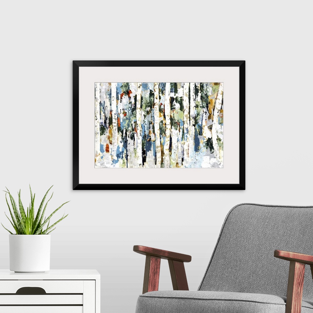 A modern room featuring Abstract painting of a wooded forest of colorful leaves.
