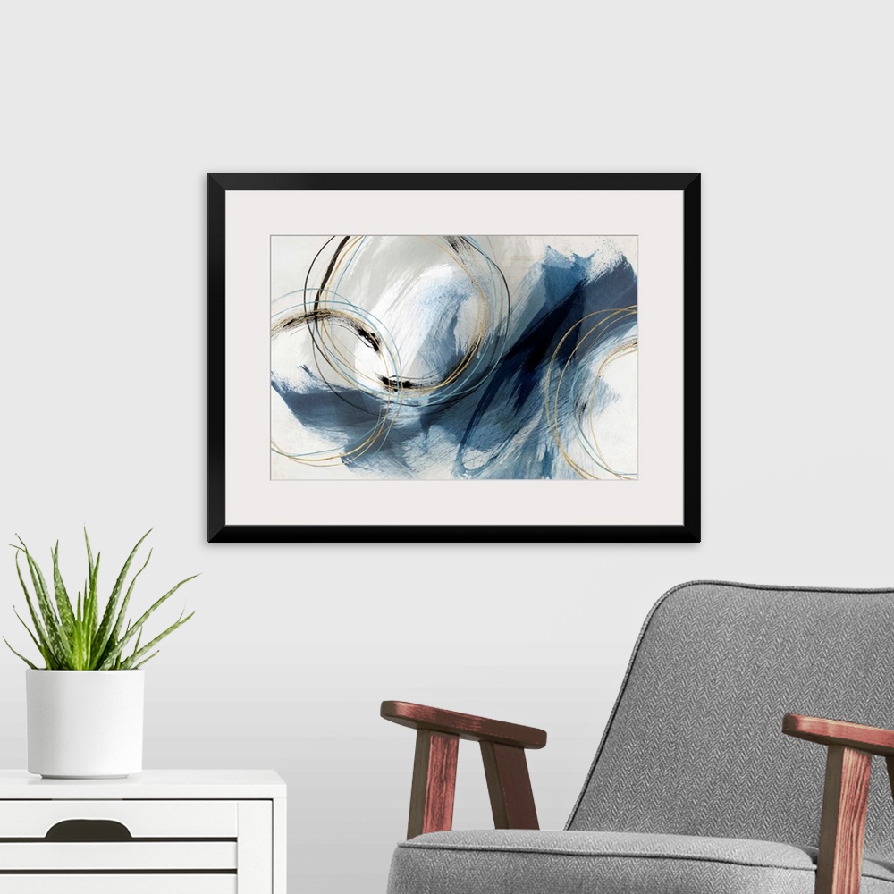 A modern room featuring Abstract painting with large blue brushstrokes and circular lines accented with gold.