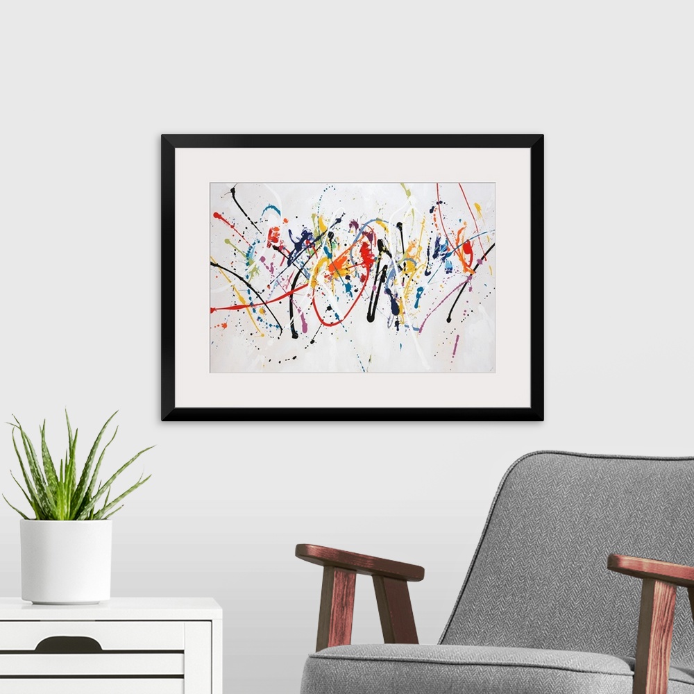 A modern room featuring Fun, contemporary painting of multi-colored paint splatters.