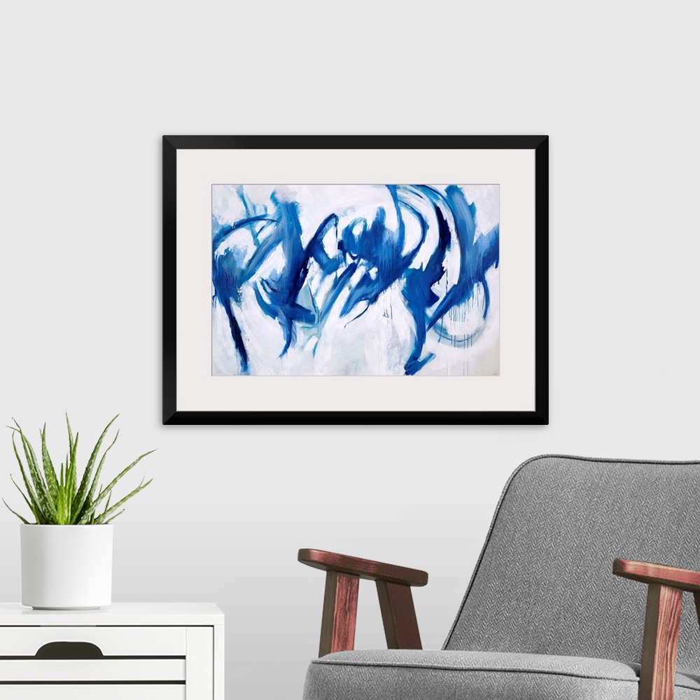 A modern room featuring Abstract painting of royal blue paint splashes and swipes as if to give the appearance of figures...