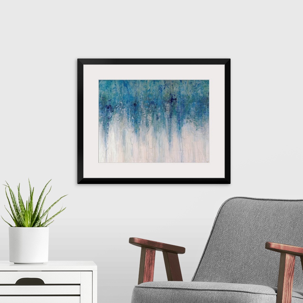 A modern room featuring Abstract artwork with different shades of blue toward the top of the print fading down to an almo...