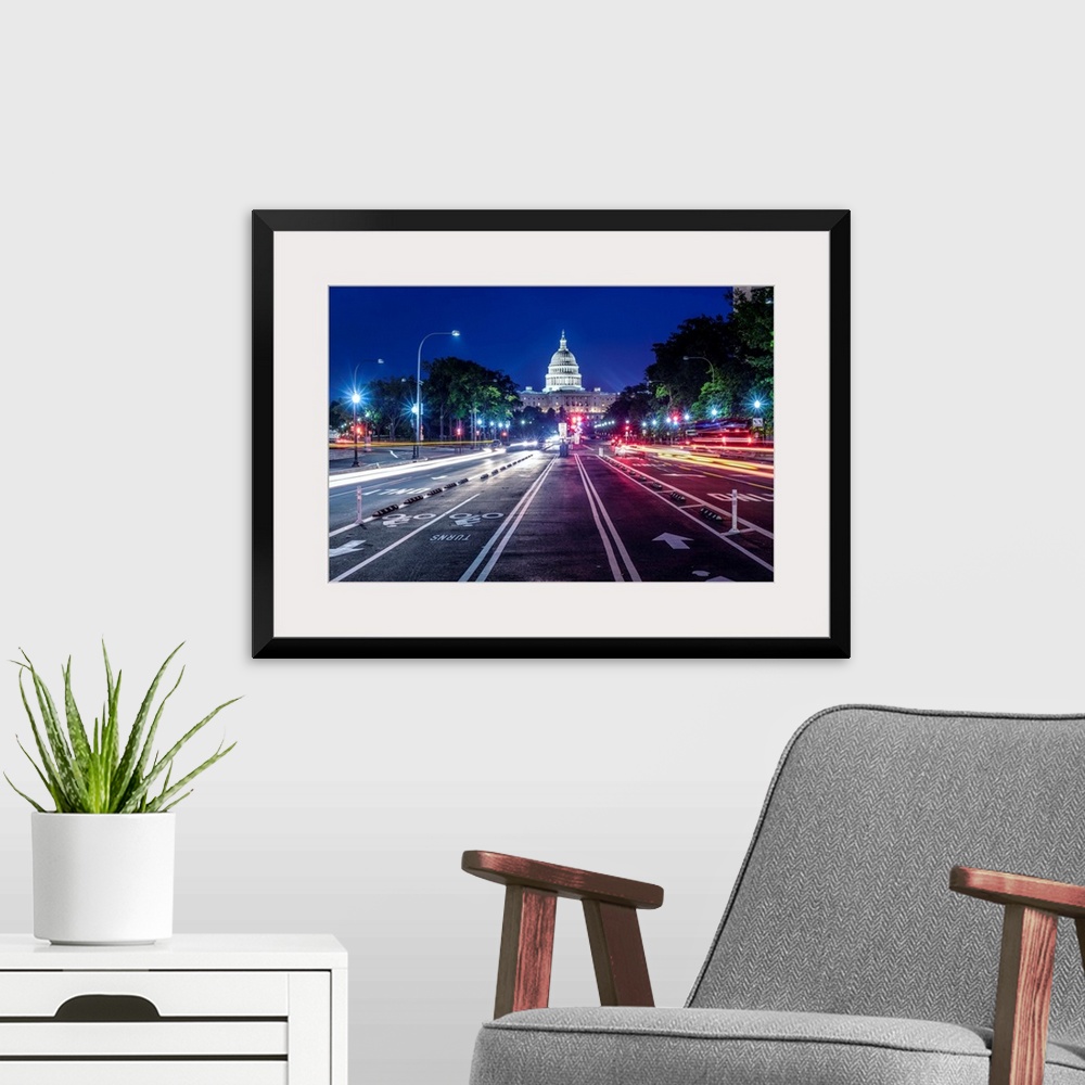 A modern room featuring Streetview of the US Capitol Building at night in Washington DC.
