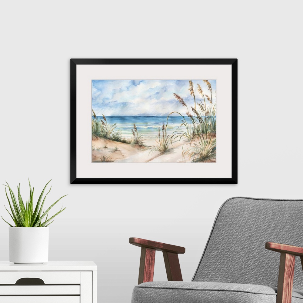 A modern room featuring A contemporary watercolor painting of grass cover sand dunes on a beach with a blue sky above.