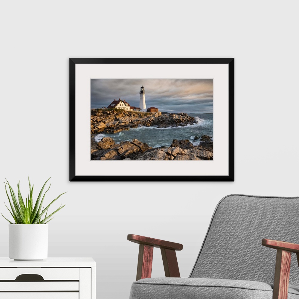 A modern room featuring Portland Maine Lighthouse at sunrise.
