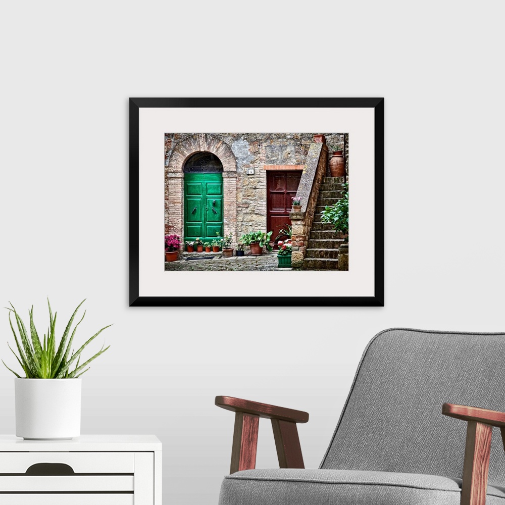 A modern room featuring A rustic city street and ancient home built from stone and brick with brightly painted doorways l...