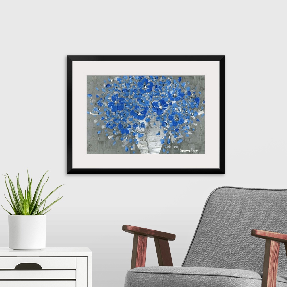 A modern room featuring Contemporary painting of a bouquet of blue flowers with silver highlights in a white vase with a ...