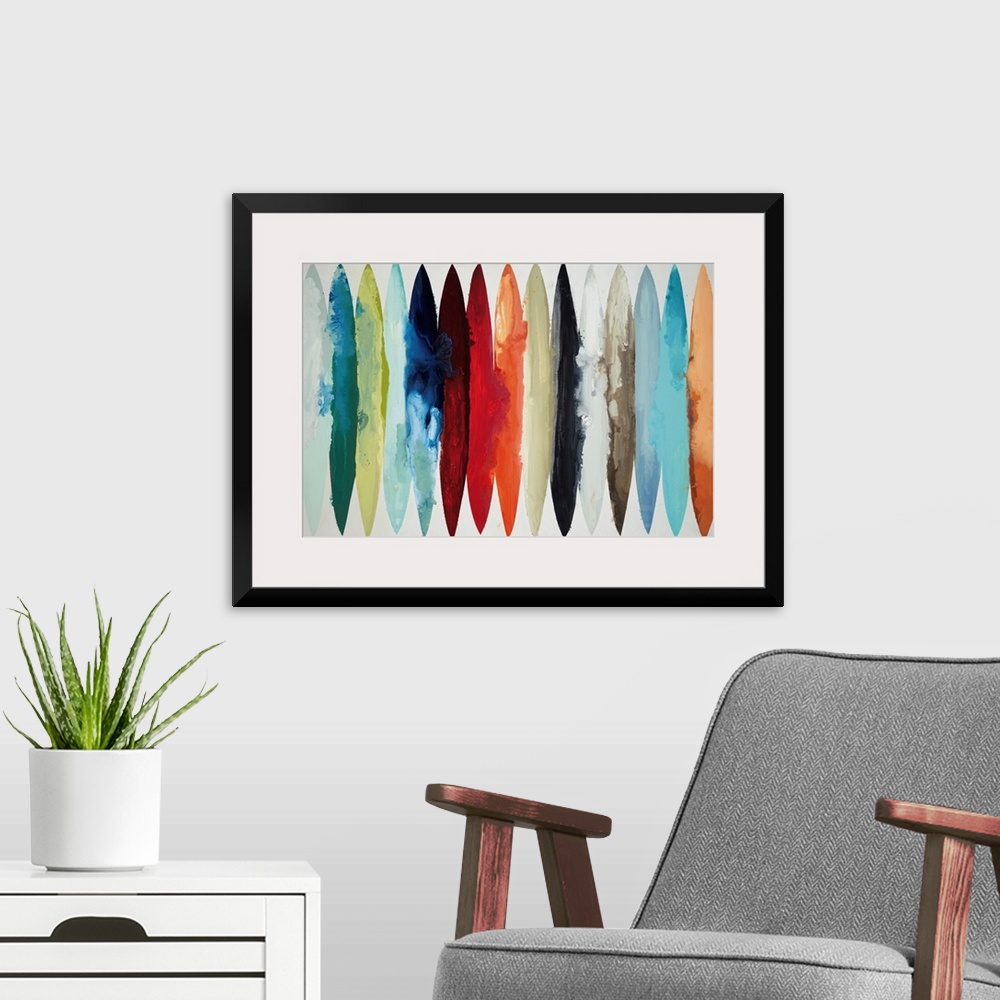 A modern room featuring Contemporary abstract painting using oblong shapes in various colors.