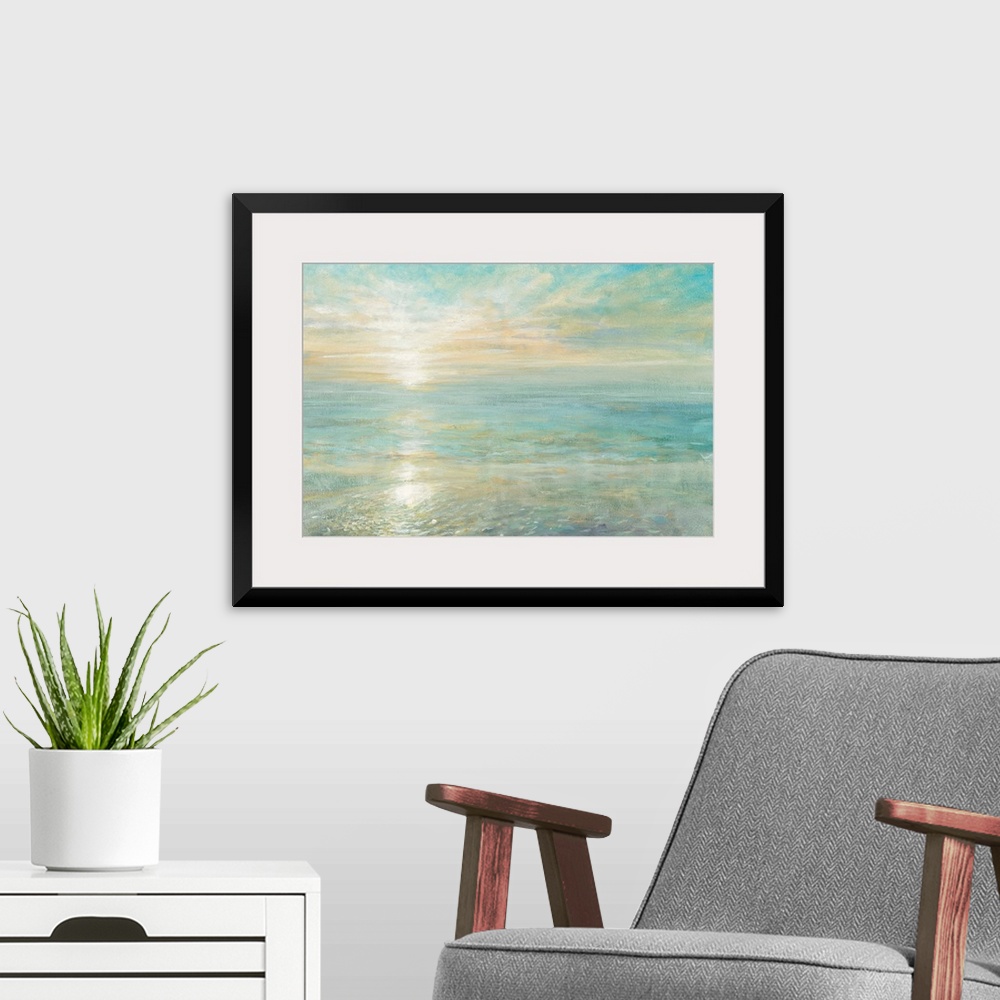 A modern room featuring Contemporary artwork of the sun rising over a calm ocean.