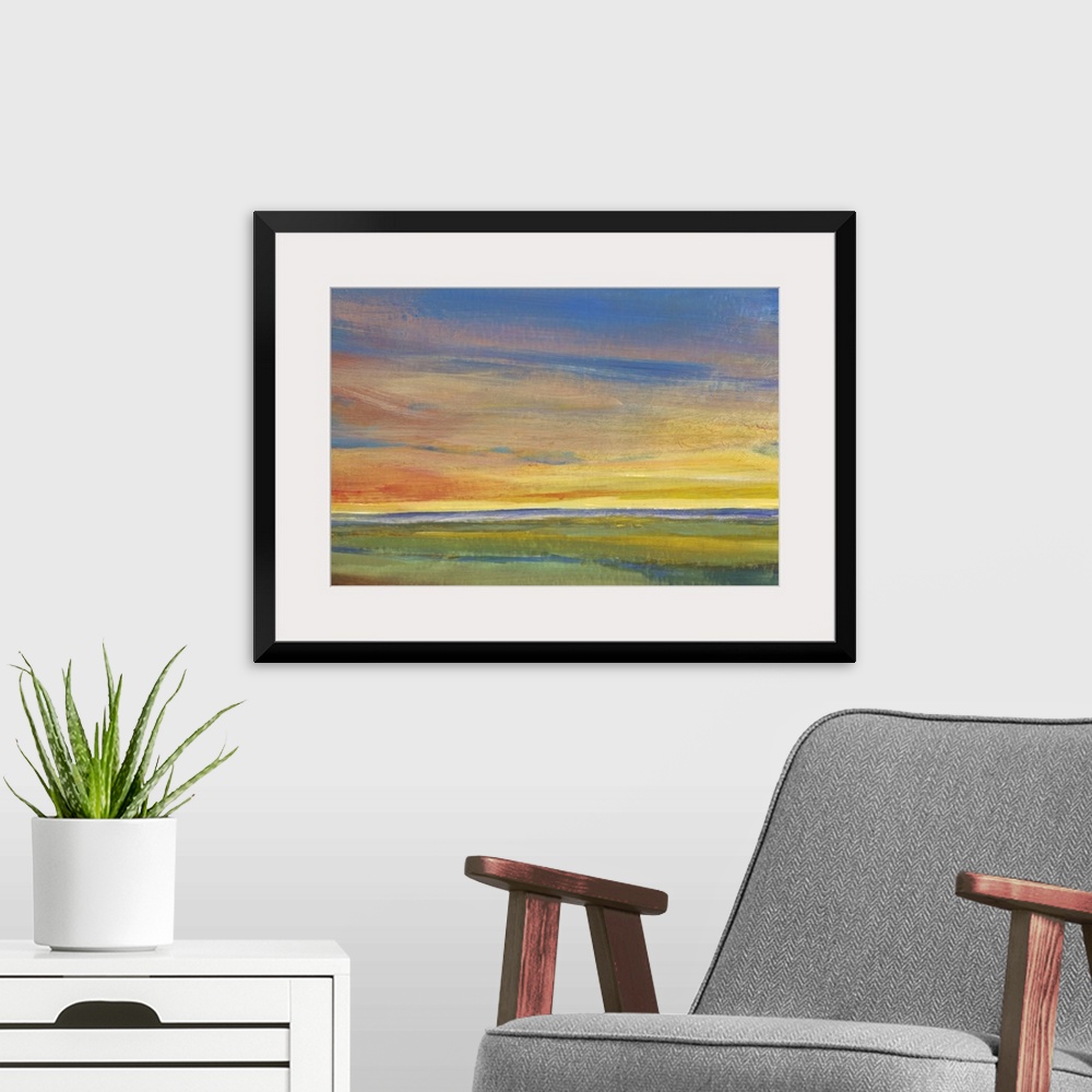 A modern room featuring Contemporary painting of a landscape at sunset, with colorful clouds.
