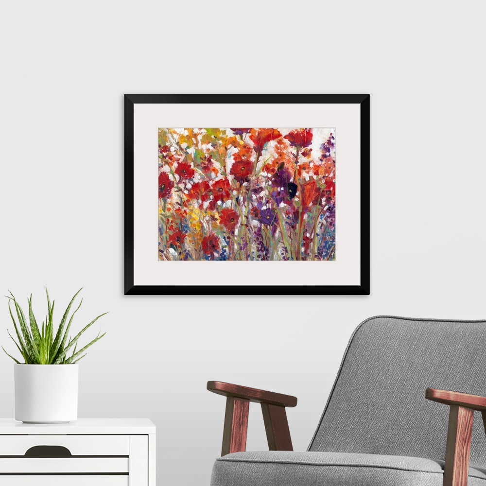A modern room featuring This decorative artwork features sprouting bright wildflowers made from whimsical brush strokes w...