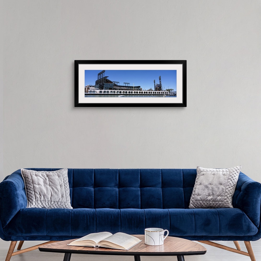 A modern room featuring The San Francisco Giants baseball stadium is photographed from the waterfront view.
