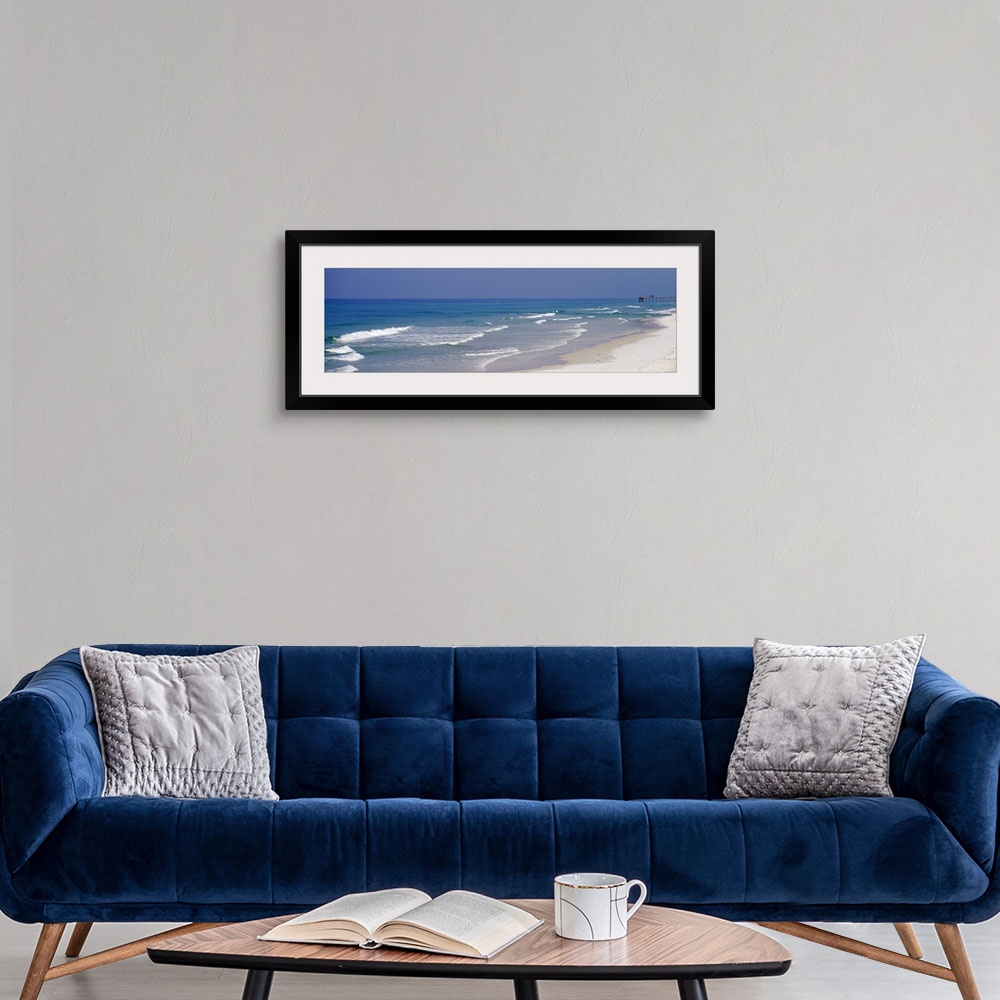 A modern room featuring Panoramic photo of waves rushing onto the sandy shoreline in Florida, on the coast of the Atlanti...