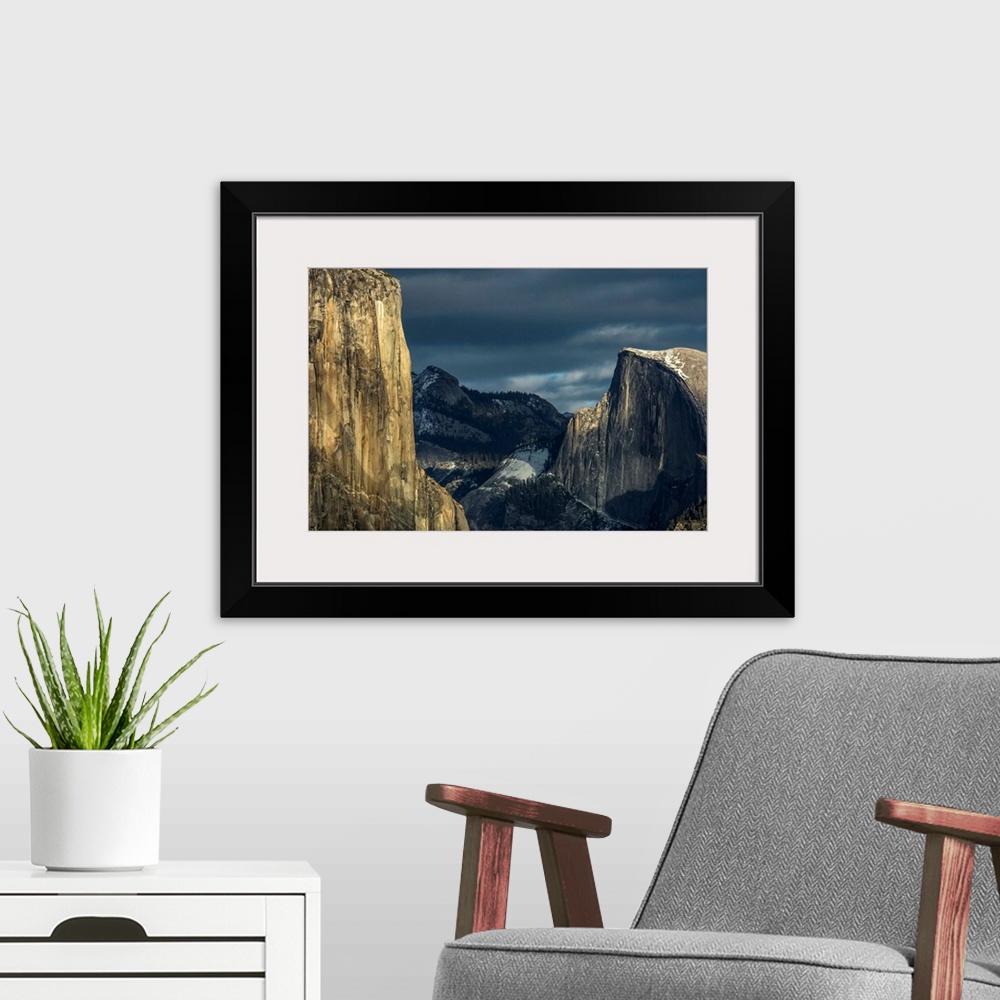A modern room featuring El Capitan and Half Dome in late afternoon winter light, as seen from Turtleback Dome in Yosemite...