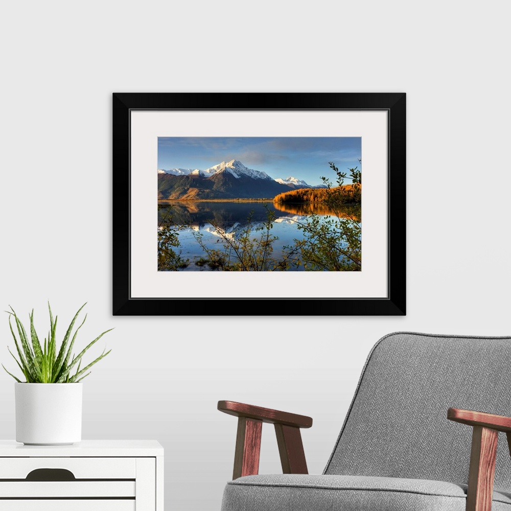 A modern room featuring Scenic view of Pioneer Peak reflecting in Jim Lake in Mat Su Valley, Alaska