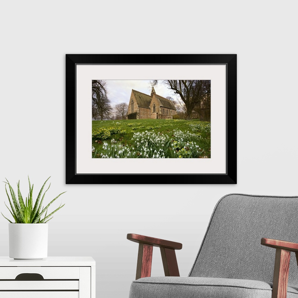 A modern room featuring White Flowers With A Small Church In Background, Northumberland, England