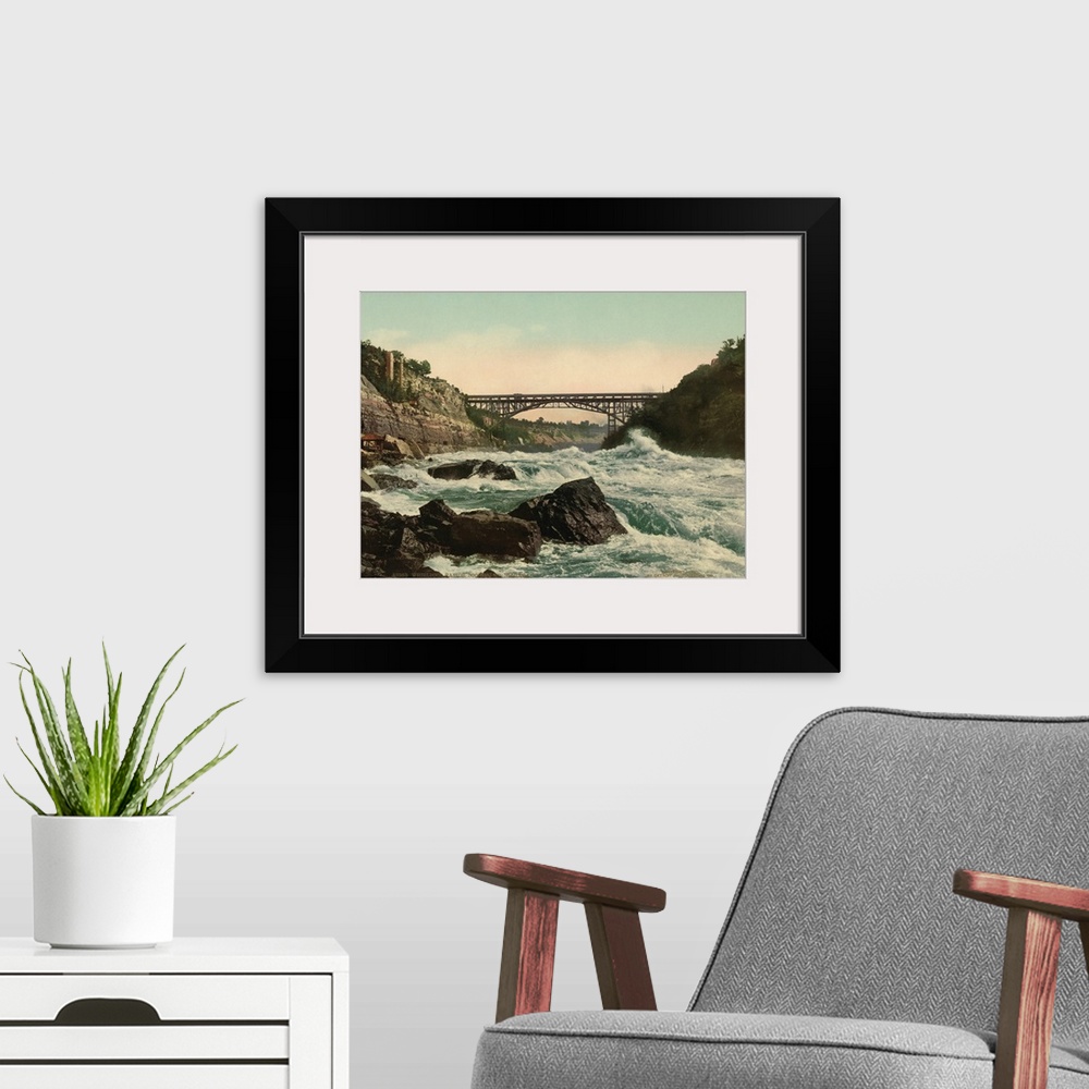 A modern room featuring Hand colored photograph of whirlpool rapids, looking up Niagara.