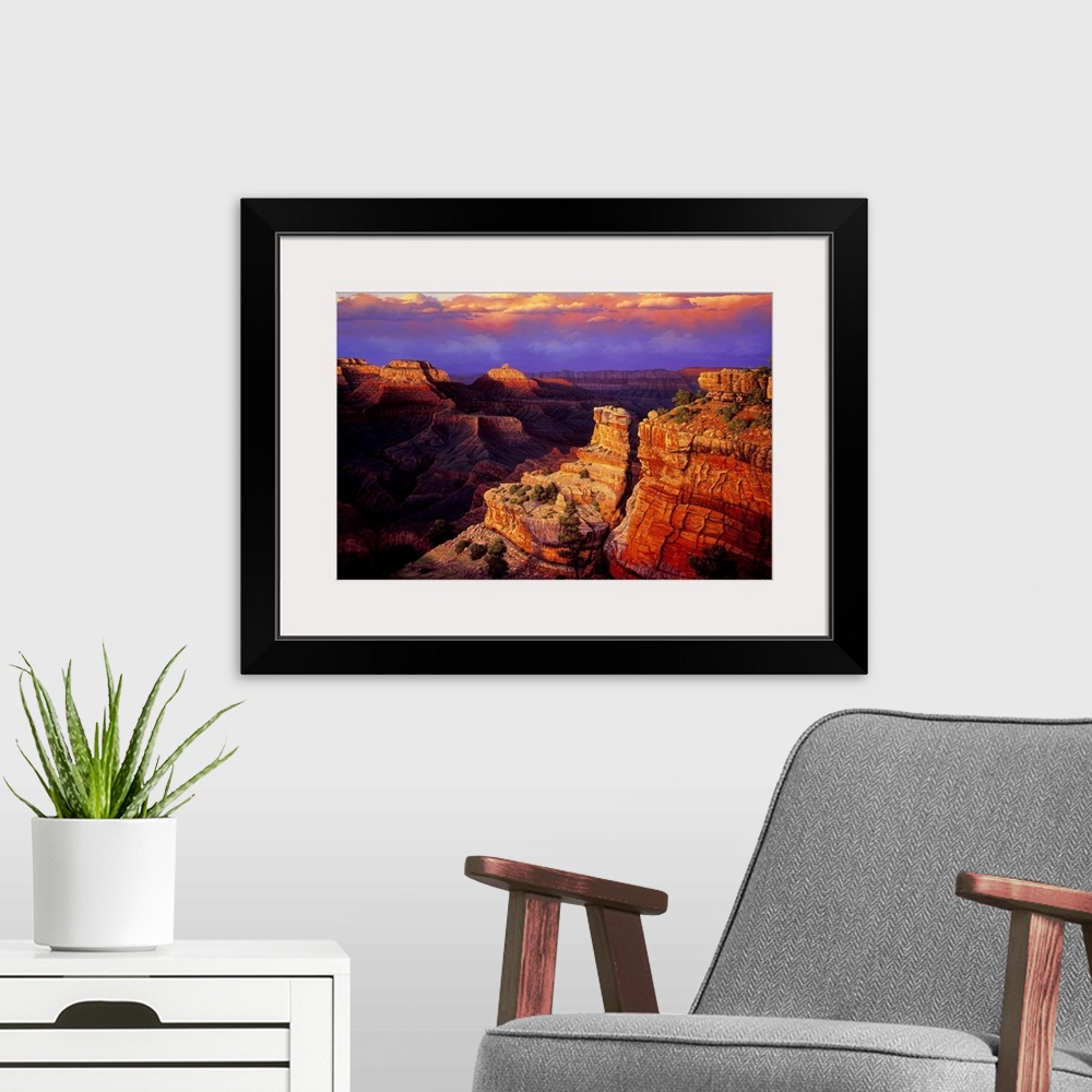 A modern room featuring Contemporary landscape painting of the Grand Canyon at sunset.