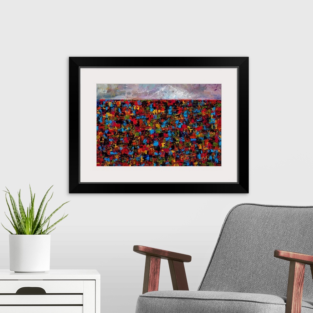 A modern room featuring Abstract landscape created with many colors and small, layered brushstrokes.