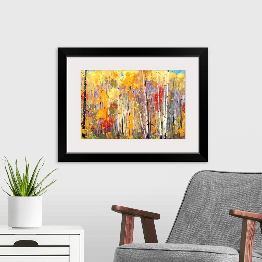A modern room featuring Contemporary painting of a forest full of colorful trees in tones of red, yellow and orange.